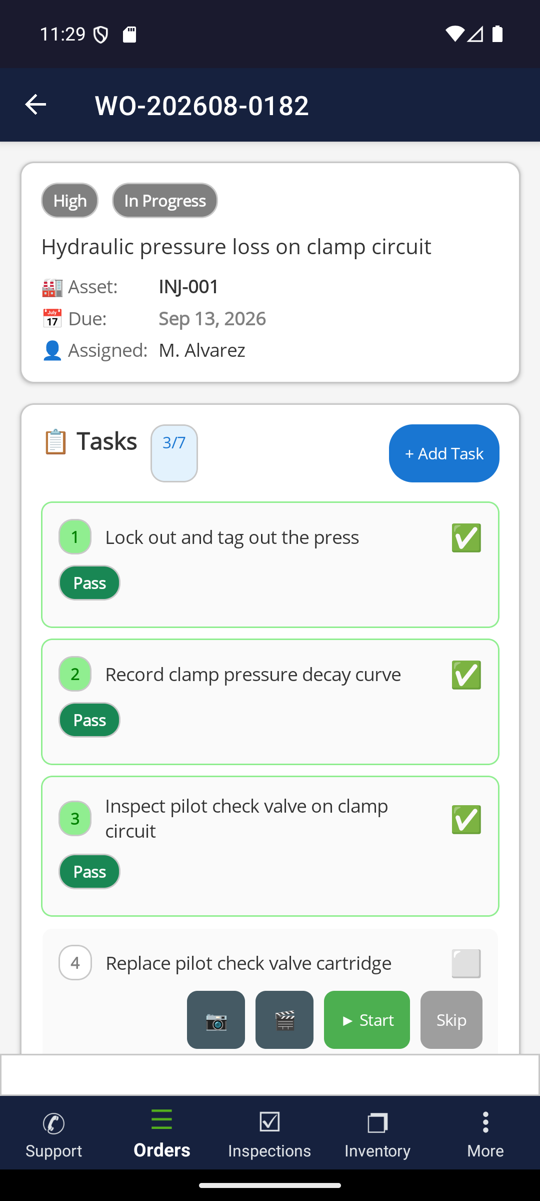 ProAlert mobile work order detail for WO-202608-0182 on injection press INJ-001, showing High priority, In Progress status, three of seven tasks passed, and photo, video, start and skip controls on the next open step